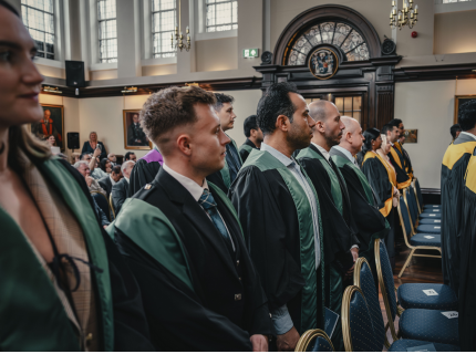 People in dental ceremonial robes